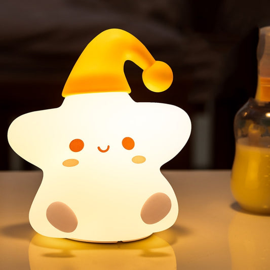 Yellow and white star-shaped silicone bedside night light with cute face