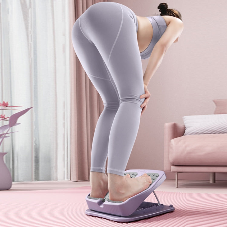 Foldable tilt fitness pedal with textured foot pads and angled gray stepping platform