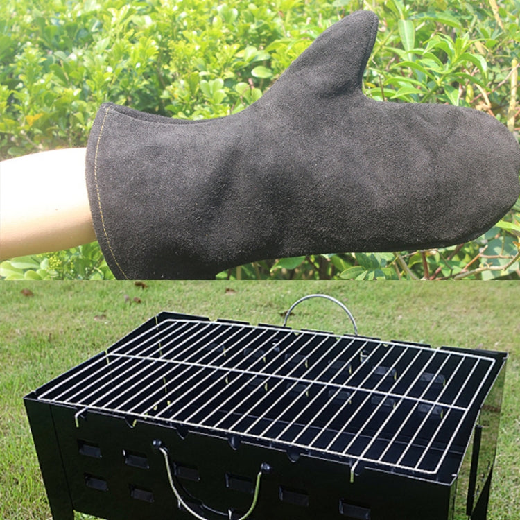 Gray heat-insulating leather BBQ glove resting on arm near grill