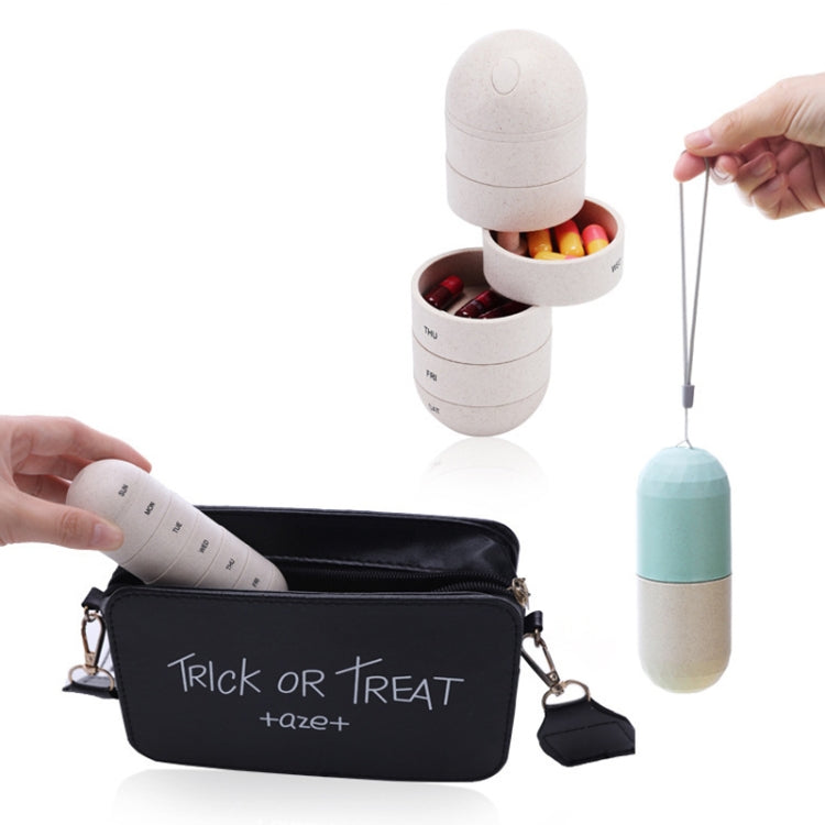 Portable 7-day pill organizer pod with strap, opened compartments and visible pills