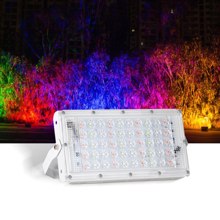 RGB LED outdoor flood light with clear housing and angled white mounting bracket