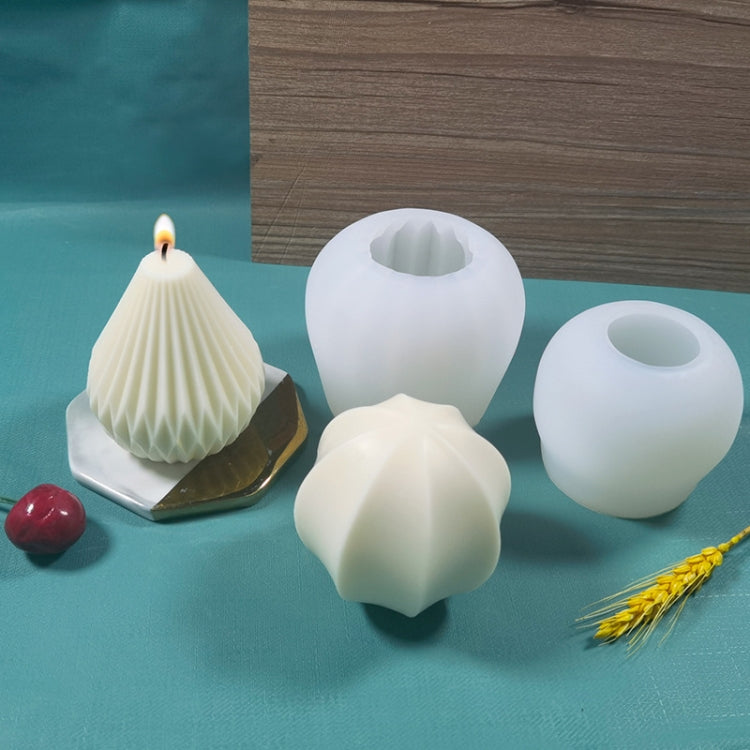 White silicone candle molds, including dome and flower-like shapes, with wicks
