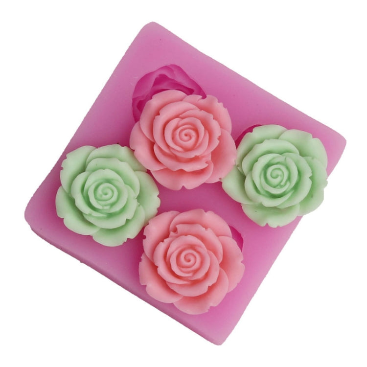 Pink silicone mold with multiple rose-shaped cavities in green and pink