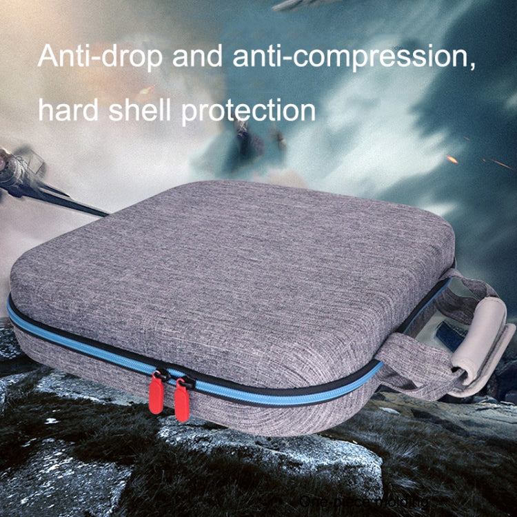 Gray hard shell console storage bag with top handle and blue-trim edge