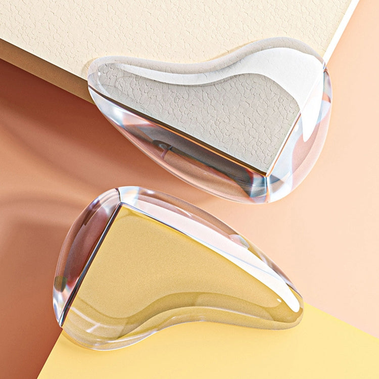 Pair of transparent teardrop corner guards installed on a wall corner