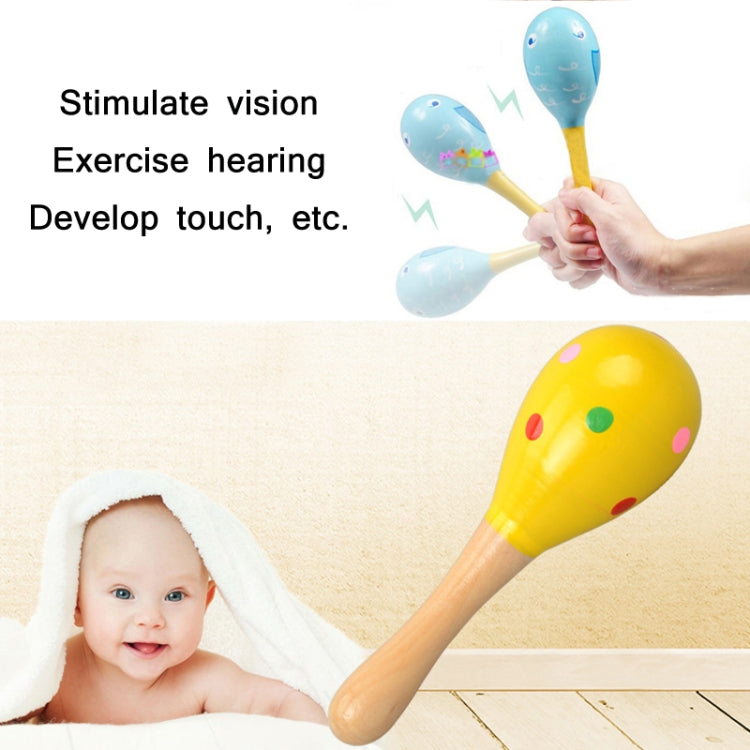 Child hand holding colorful sand hammers with painted heads on wooden handles
