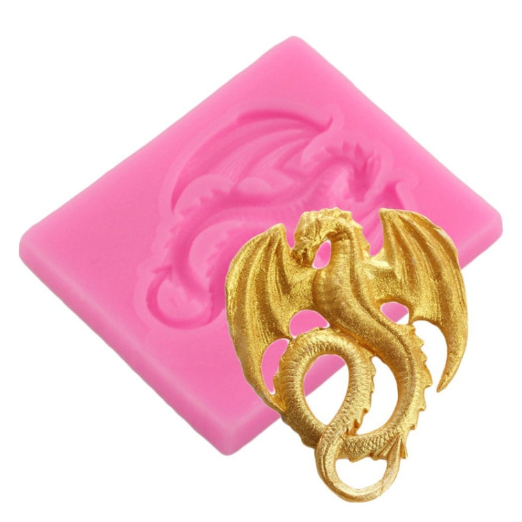 Pink silicone mold with embossed pterodactyl relief, shown with gold clay cast