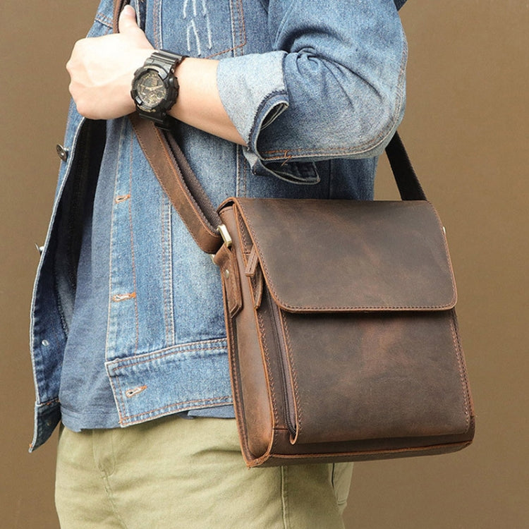 Men's brown leather flap messenger shoulder bag worn crossbody with adjustable strap
