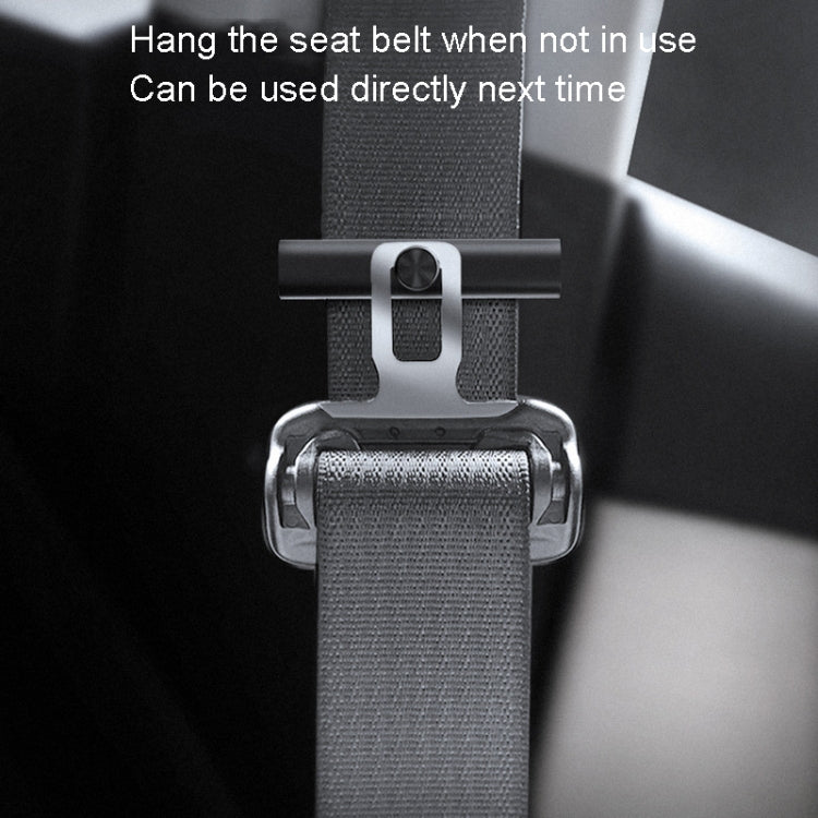 Car seat belt holder with silver metal clasp attaching to the seat belt