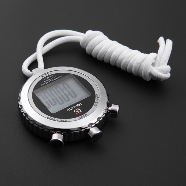 Round metal electronic stopwatch from above with gray digital screen and white lanyard