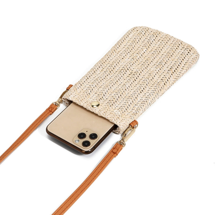 Beige straw phone pouch with tan leather strap and metal snap, phone inside