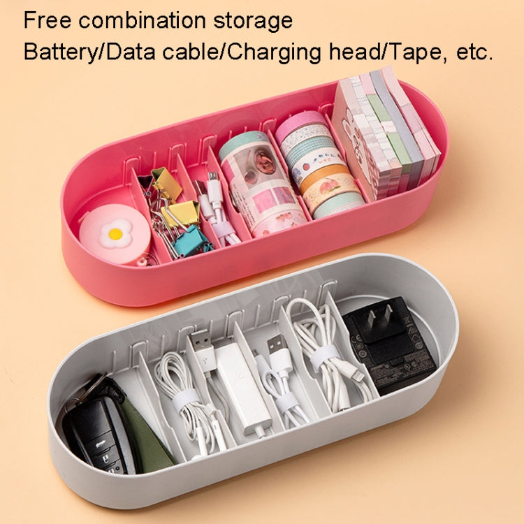 Pink and gray storage cases for batteries and cables, open with assorted accessories