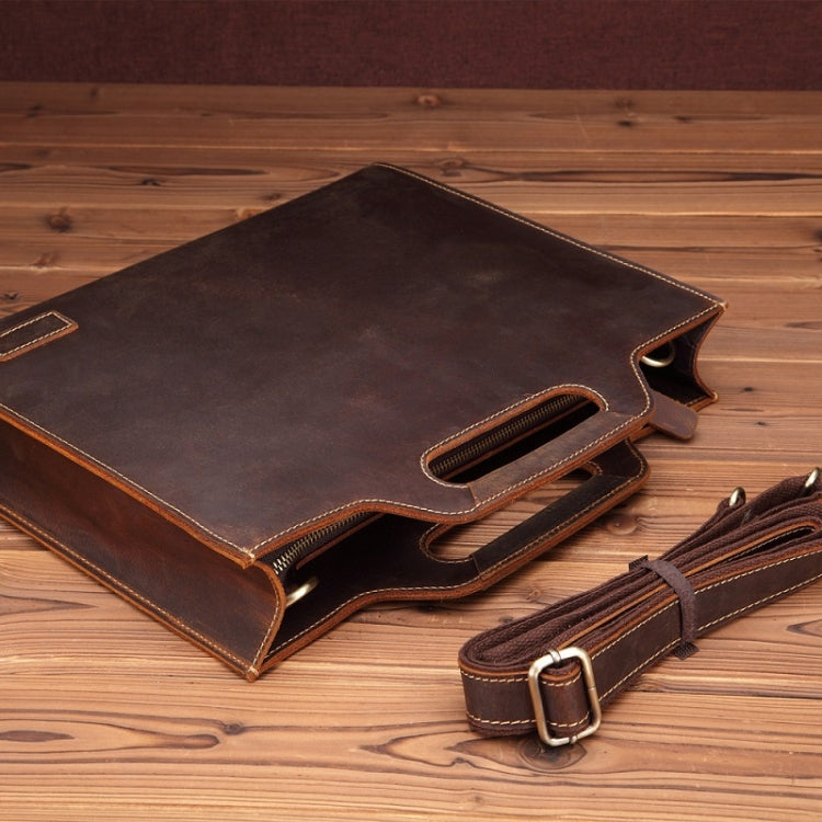 Dark brown leather briefcase with foldover flap, front zipper pocket, and crossbody strap.