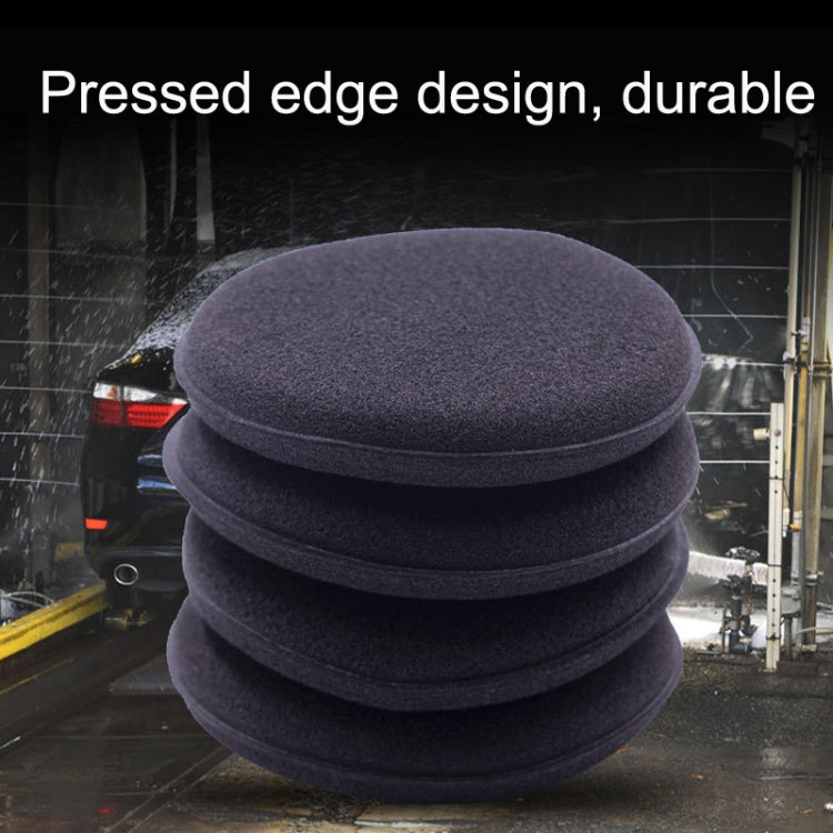 Stacked round dark pressed-edge waxing sponge pads for car polishing