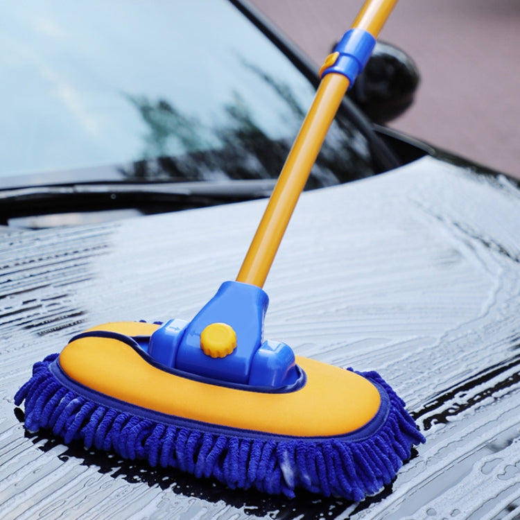 Curved car wash mop with blue bristle brush and yellow base cleaning a vehicle surface