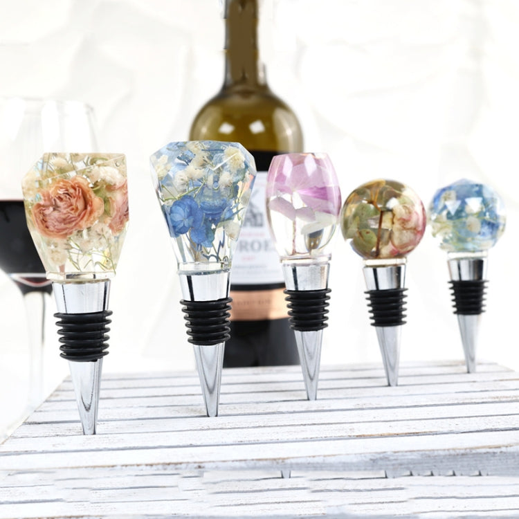 Collection of crystal epoxy wine stoppers on metal stems with floral resin designs