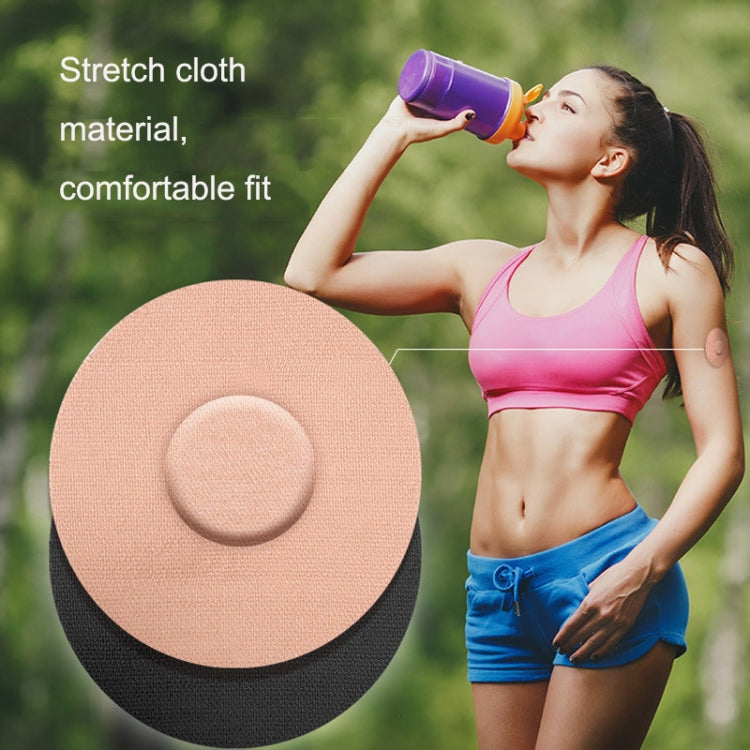 Round beige adhesive patch with circular center on dark backing
