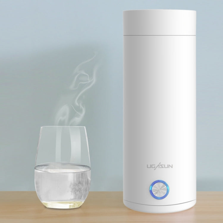 White electric heated water cup with blue power button and steaming hot drink