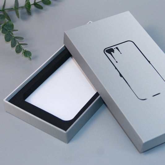 White phone case packaging box open with black insert tray