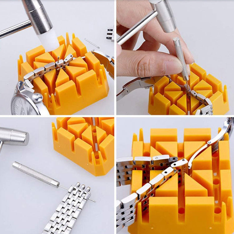 Watch bracelet link removal in progress using pin punch and strap tool over orange tray