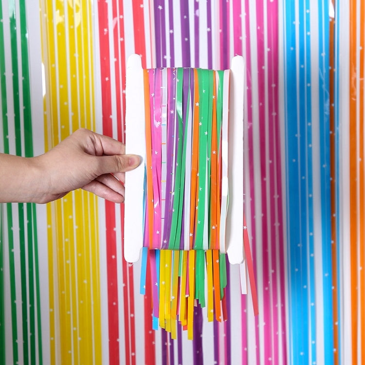 Rainbow rain curtain mounted on tape to a backing card, hand pressing