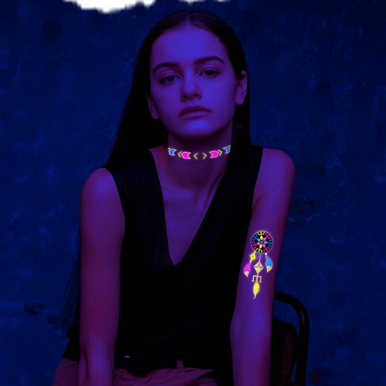 Fluorescent tattoo stickers on skin: neon collar pattern with arm mandala design
