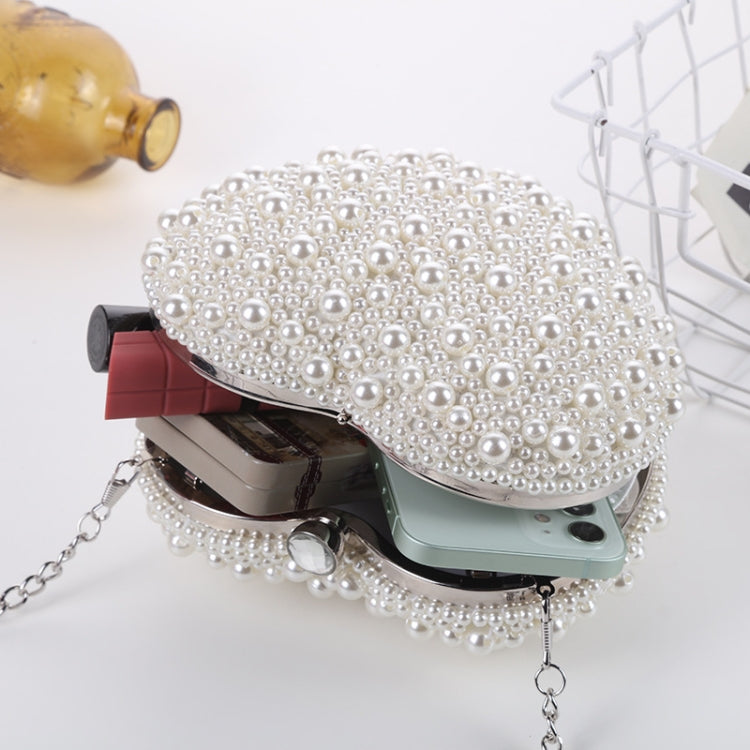 Pearl heart crossbody clutch with silver chain strap and beaded finish