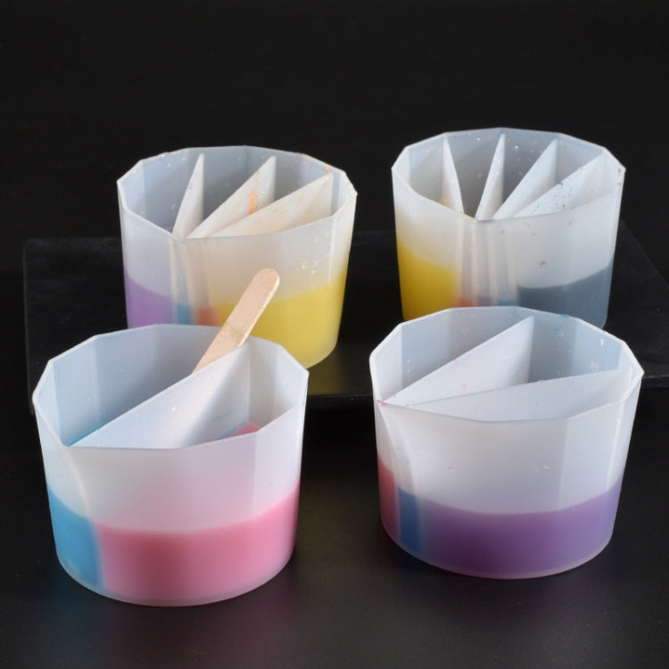 Four white silicone color mixing cups with internal channels and layered color bands