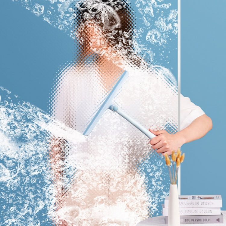 Blue-handled window wiper with rotating scraper head in use on glass