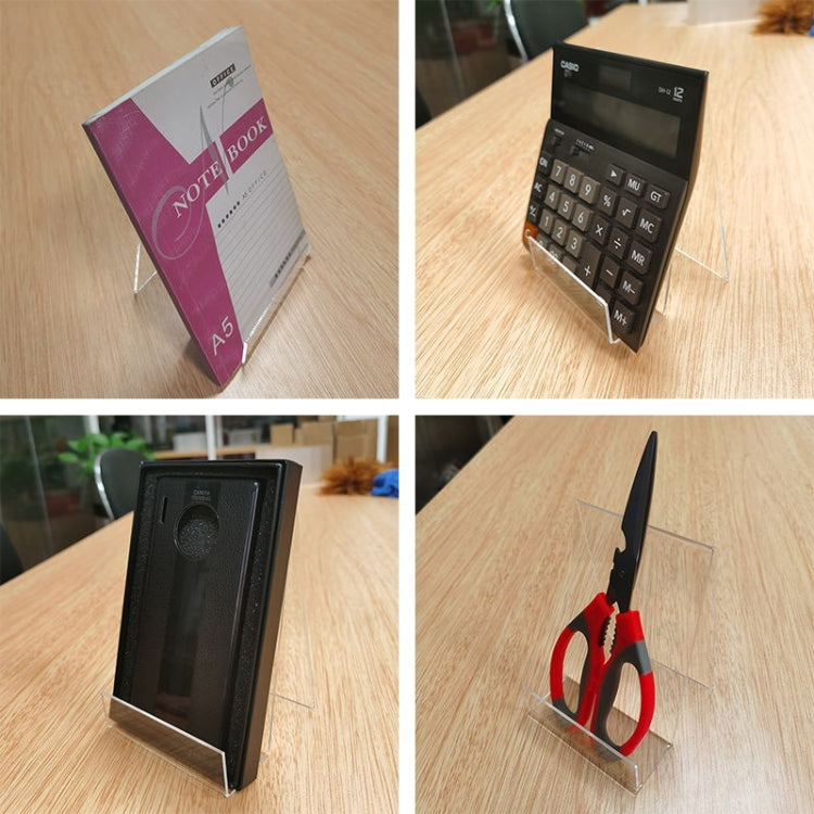 Transparent acrylic display stand holding a notebook or booklet on desk