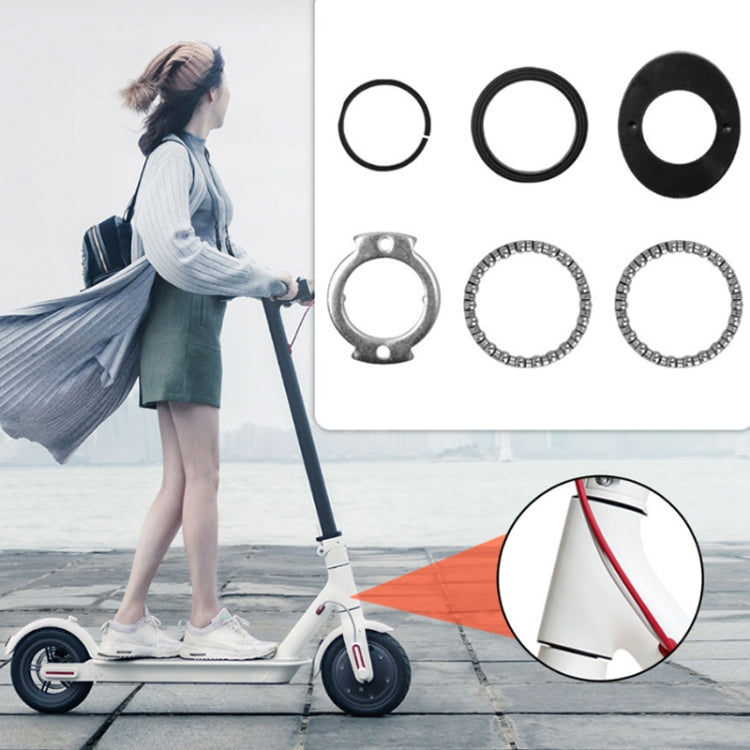 Electric scooter wrist set kit with multiple black rings, silver clamp, and metal bead rings