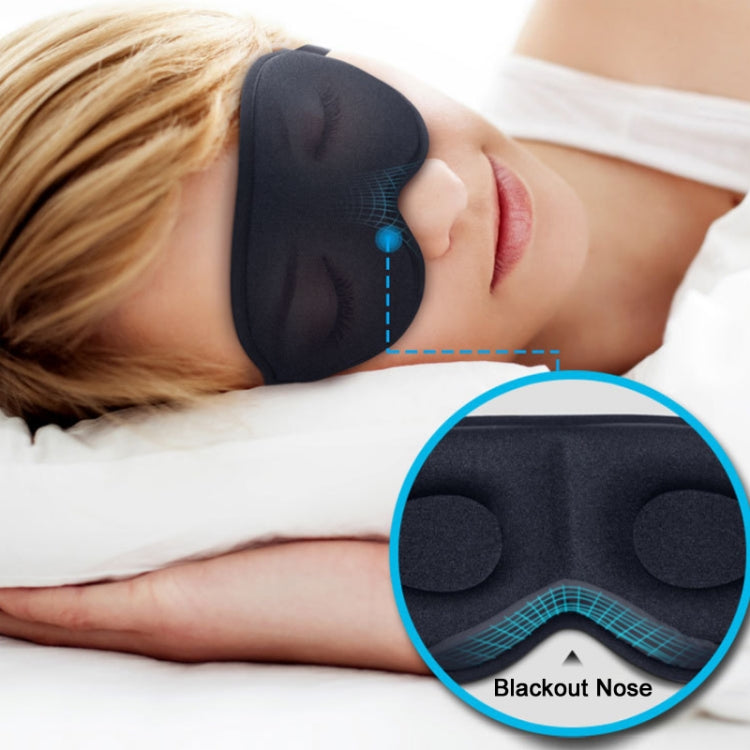 Dark gray eye mask with nose wing worn over eyes, showing 3D oval pads