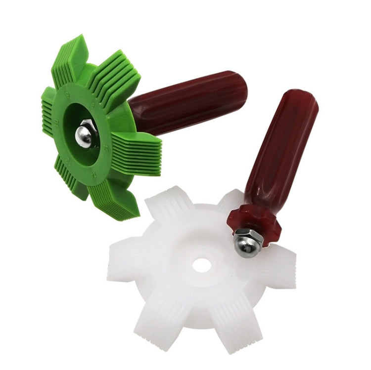 Green and white fin cleaning comb brushes with red handles