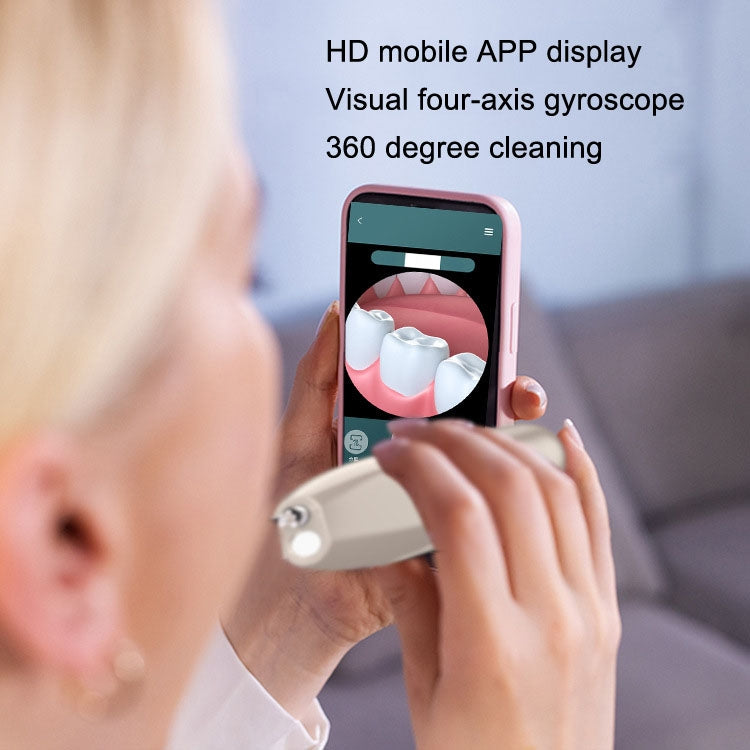 Person using electric dental scaler with phone app display and handheld device