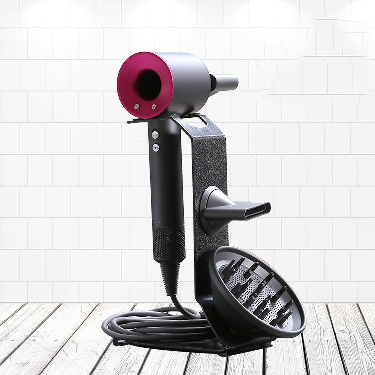 Free-standing hair dryer stand with black base, textured panel, pink dryer ring