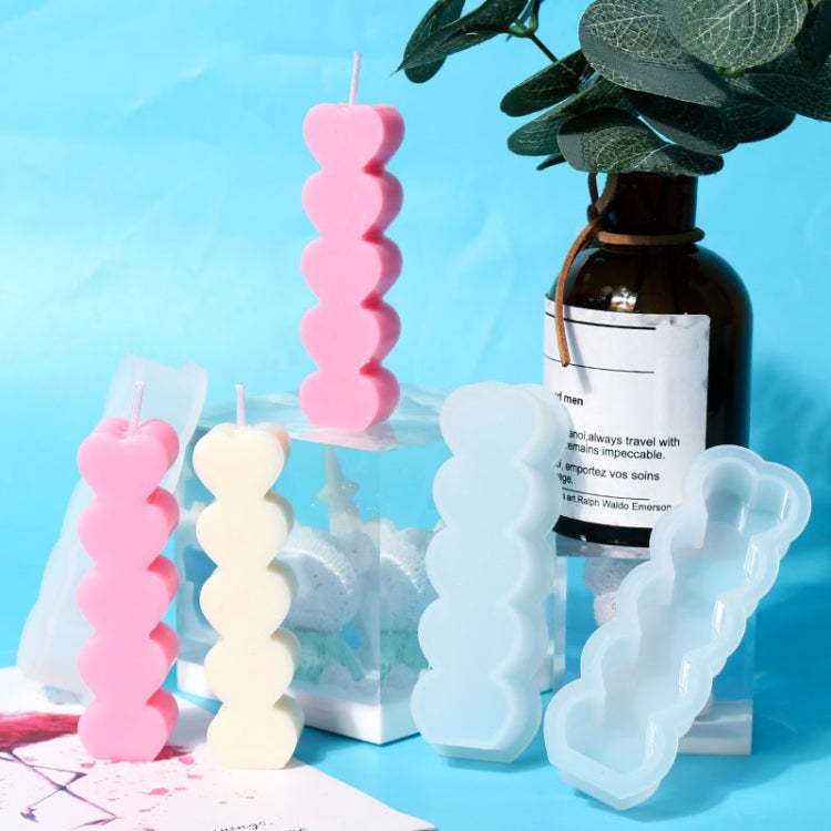 Pink and white silicone heart candle molds with triple stacked heart cavities