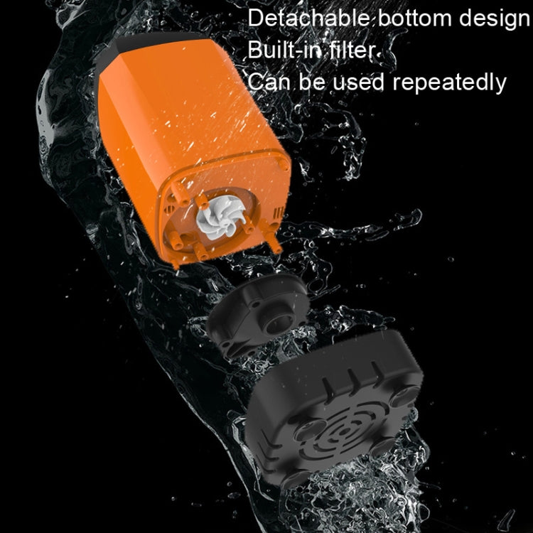 Portable electric shower pump close-up with orange body and detachable bottom filter