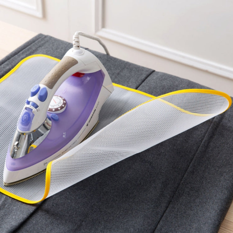Gray steam iron insulation mesh pad with yellow border, iron resting on top