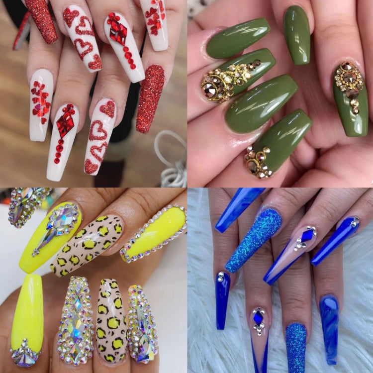 Nail art featuring glitter tips and gemstone accents on multiple colored acrylic nails