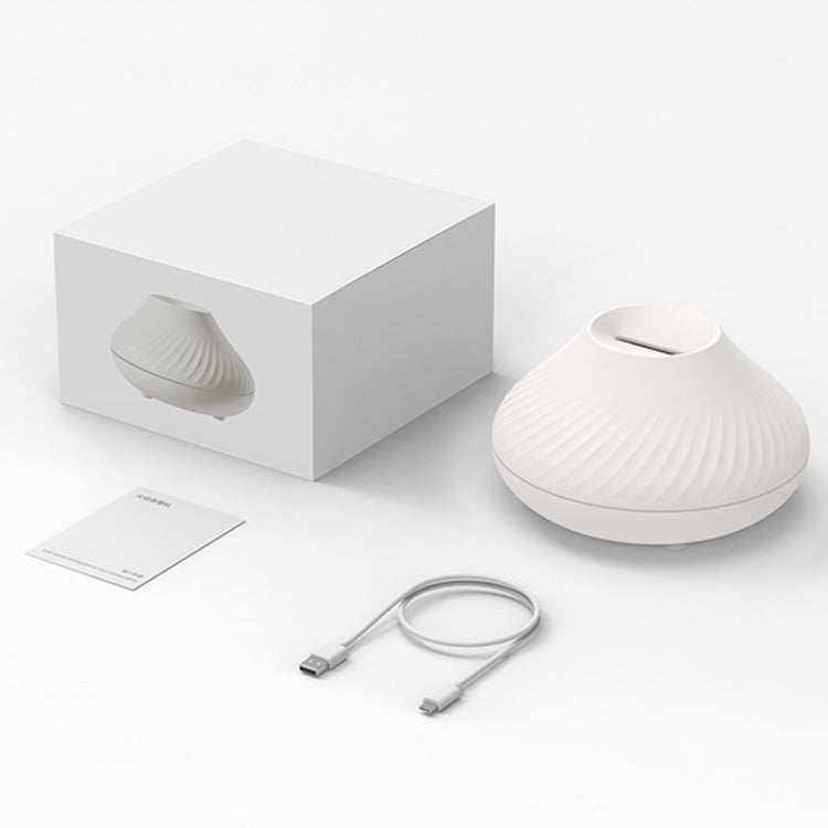 White aroma diffuser humidifier with ribbed top, box, and USB charging cable