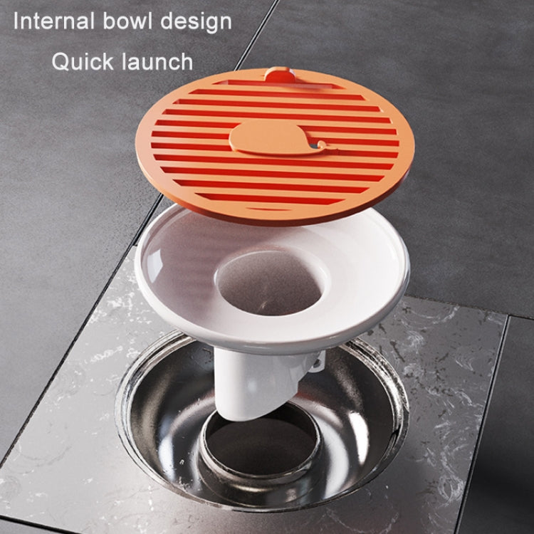 Orange magnetic suction floor drain cover open over a round drain