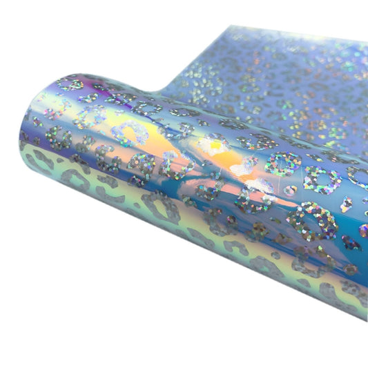Self-adhesive vinyl decal roll with holographic blue leopard print