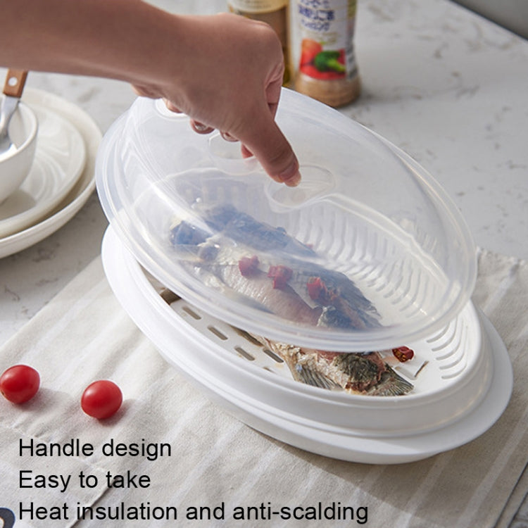 Oval microwave fish steamer tray with clear lid and side handle for easy lifting.