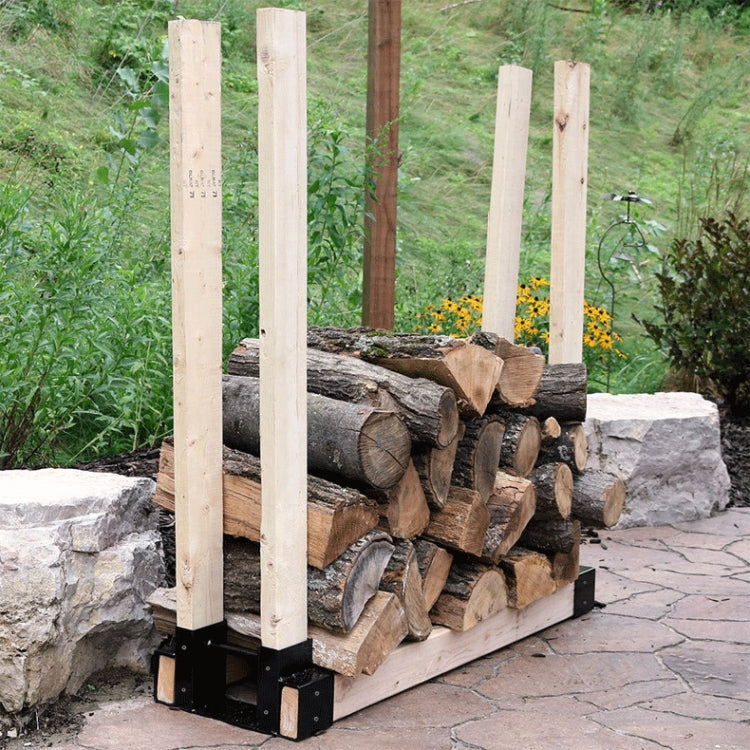 Outdoor wood storage rack with tall posts and stacked firewood in black frame