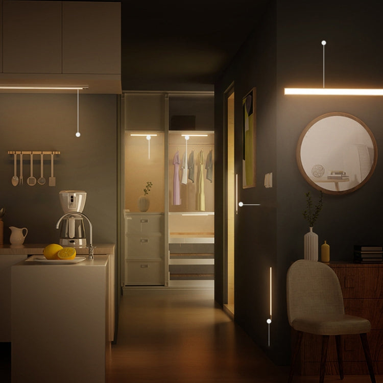 Warm glowing LED wardrobe light bars with motion sensing, installed in a closet