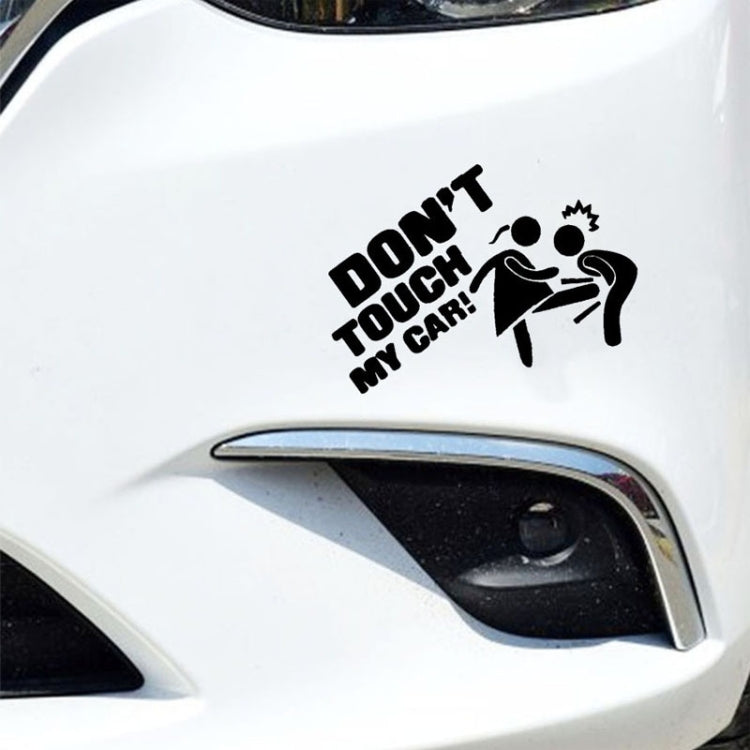 “DO NOT TOUCH MY CAR” decal on a white car near the headlight, black text and icons