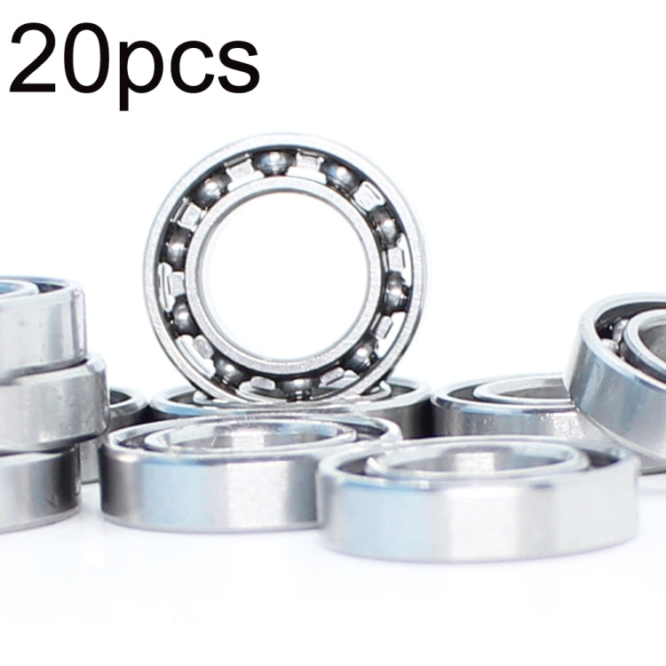 Miniature ball bearing set with visible circular inner race and metal outer shell
