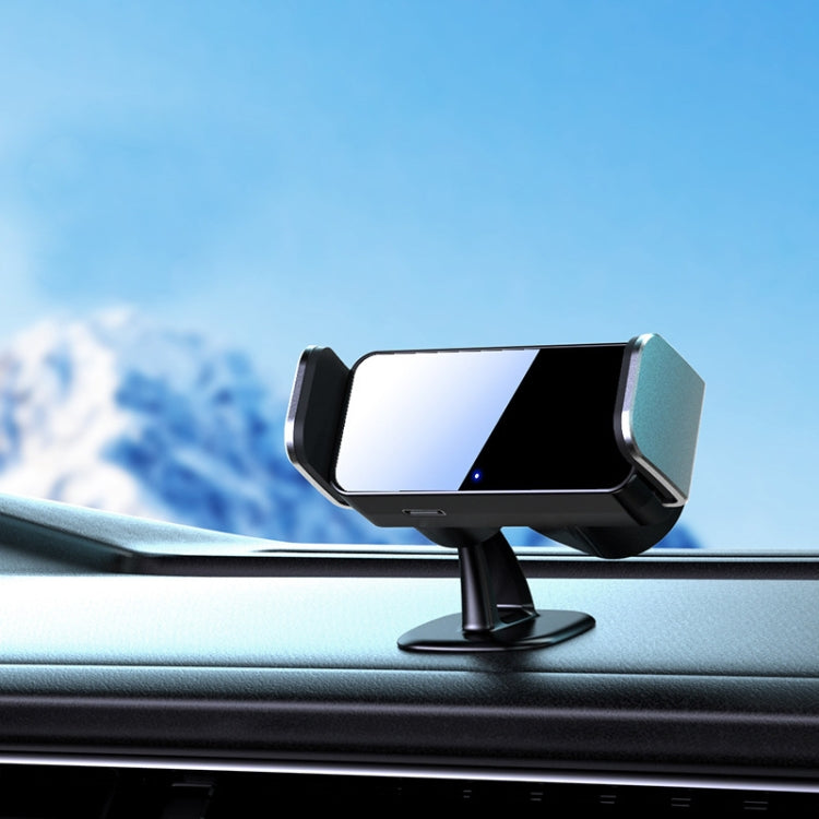 Black electric car phone holder on dashboard stand with phone displayed
