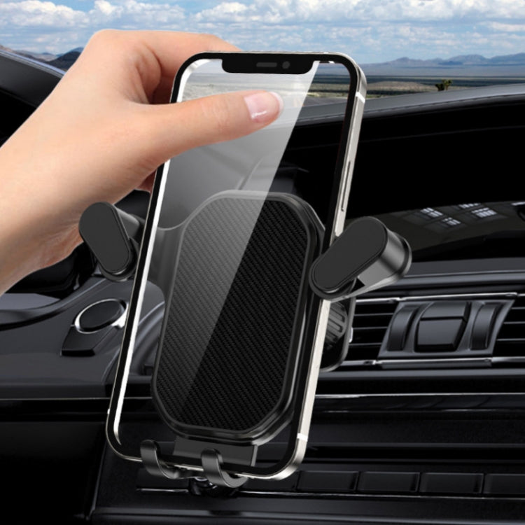 Car air vent phone holder holding a smartphone securely, cool black clamp