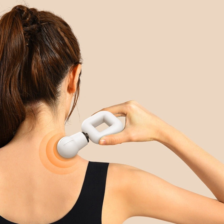 White mini fascia massager applying pressure to neck with vibration waves